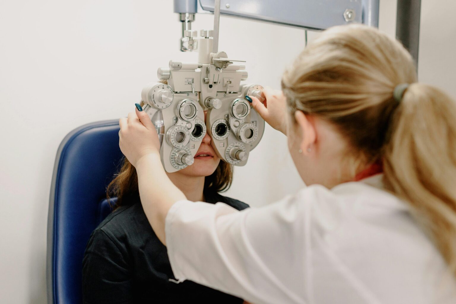 Optician examining patient